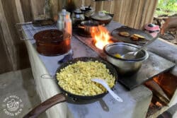 pans with food on a woodstove