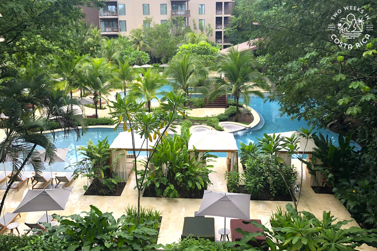 looking at a pool and hotel buildings from above