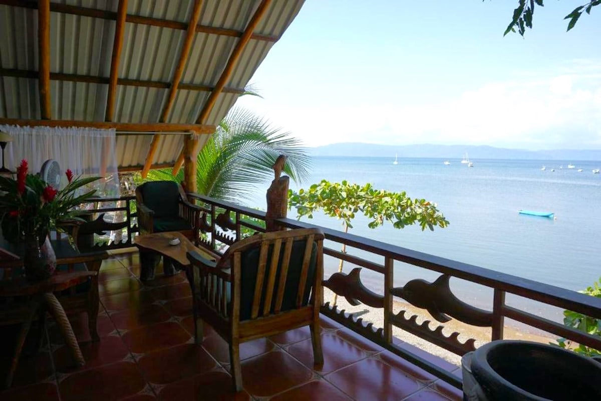 an upper level deck looking out to the ocean