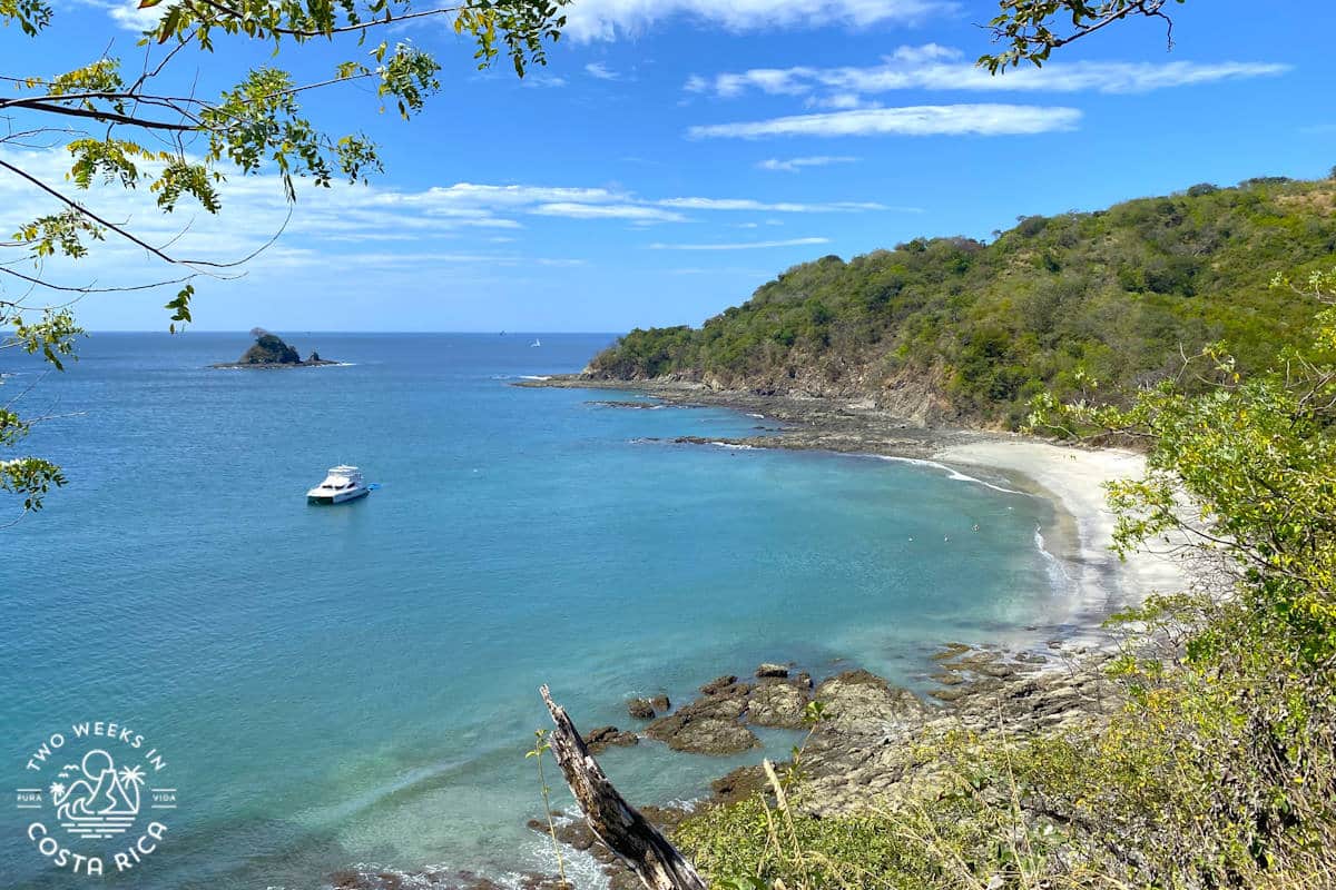 looking down at an ocean cove with calm water