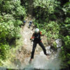 rappelling down tall waterfall arenal area