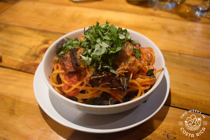 A bowl of pasta with garnishing 