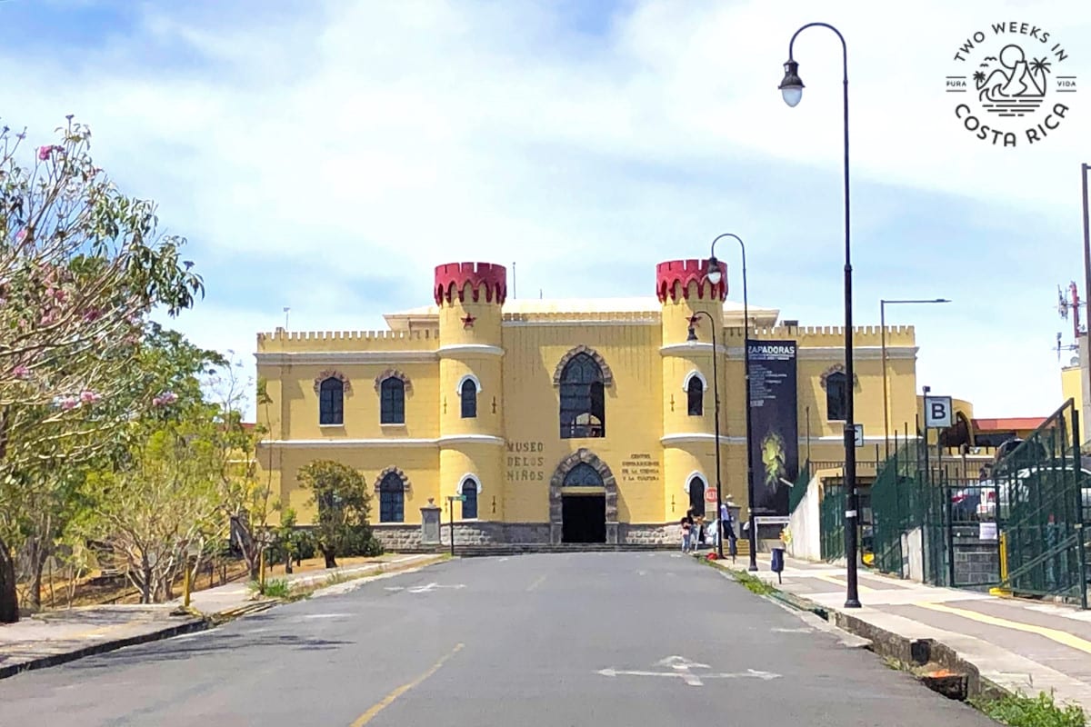 a yellow building that looks like a castle with the words children's museum