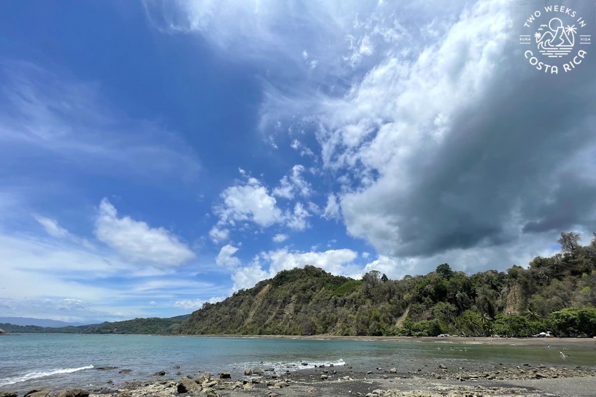 Costa Rica beach with sunny skies and dark clouds at the same time