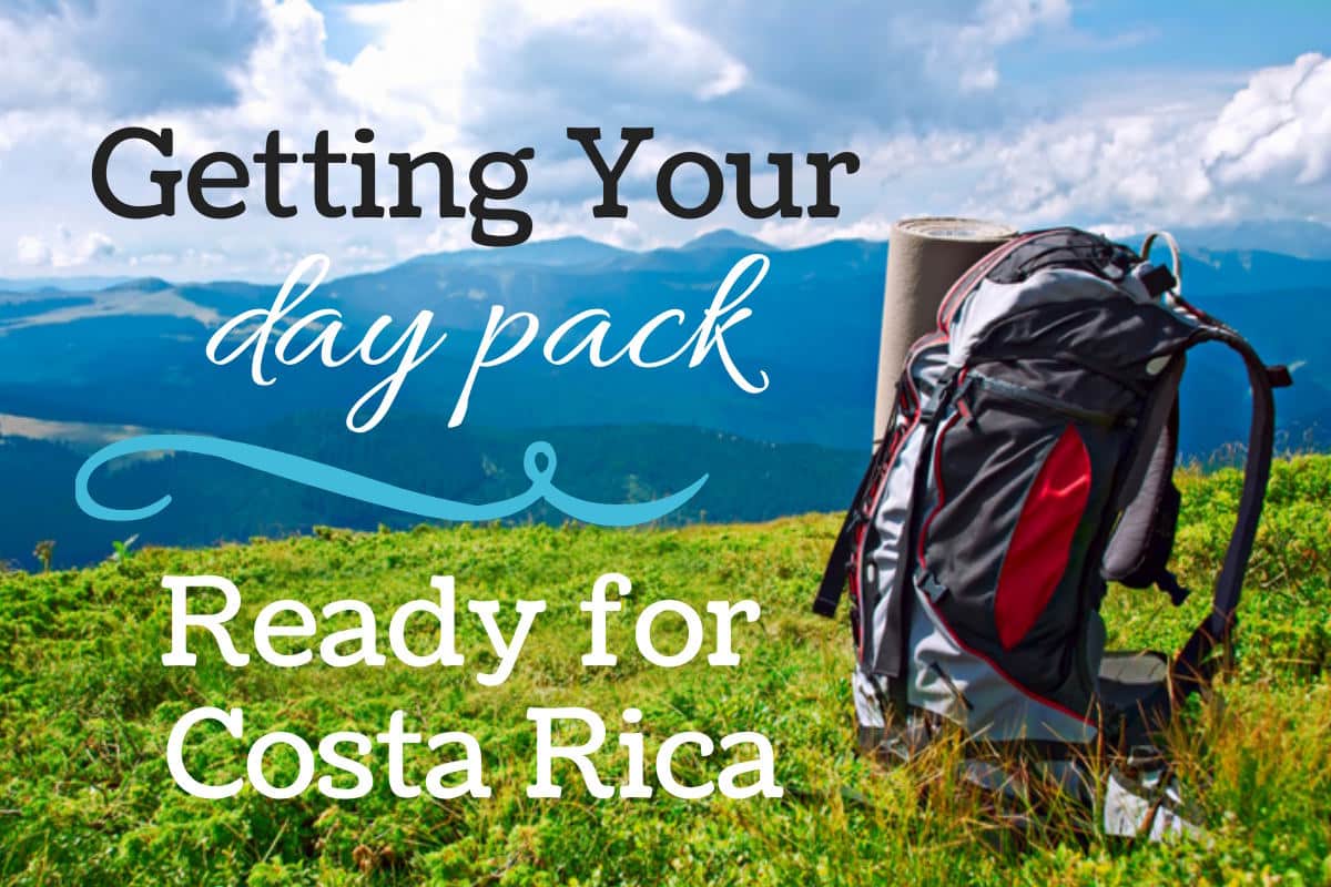 a backpack on the grass with mountains in the distance and text that reads getting your daypack ready for costa rica