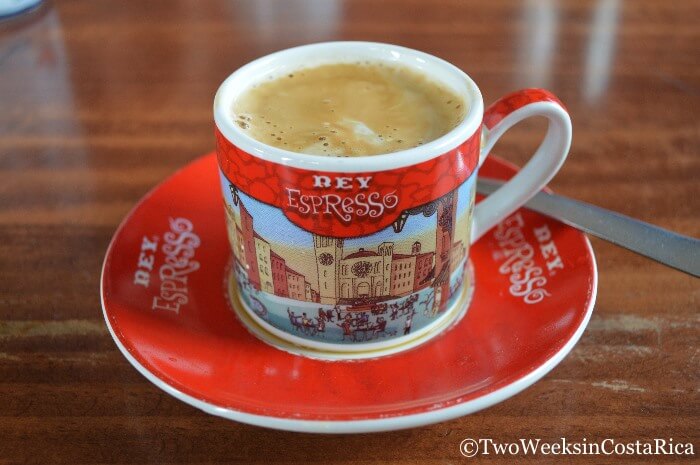red coffee cup with words rey espresso