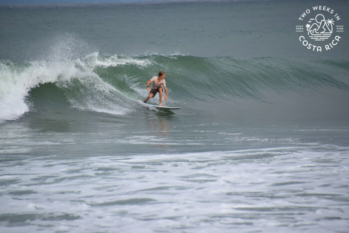 Some catching a wave surfing in Pavones