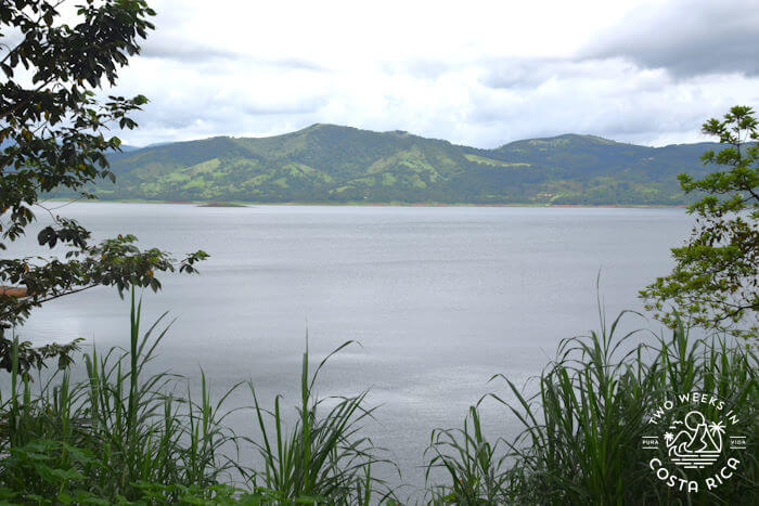 Lakeside view with small mountain in distance