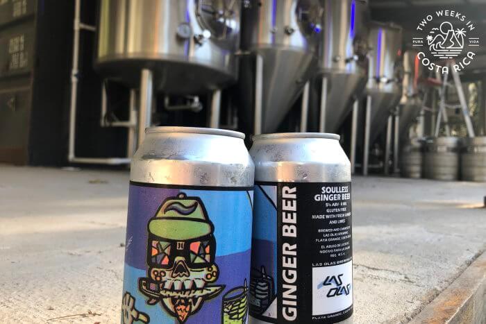 The brew tanks at Las Olas Brewery with cans of beer