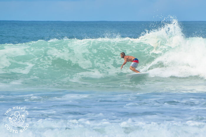 Surfer catching a wave at Playa Negra Guanacaste