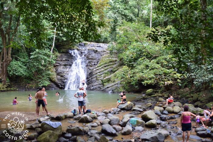 People swimming at Poza Azul waterfall in Dominicalito Costa Rica