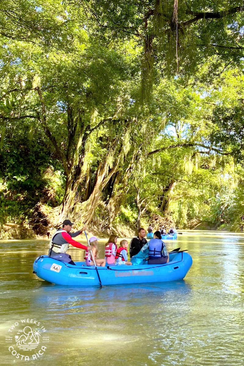 a raft on a calm river with many trees