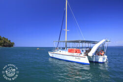 catamaran with a slide in calm ocean water