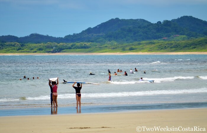 people surfing at Tamarindo Beach 