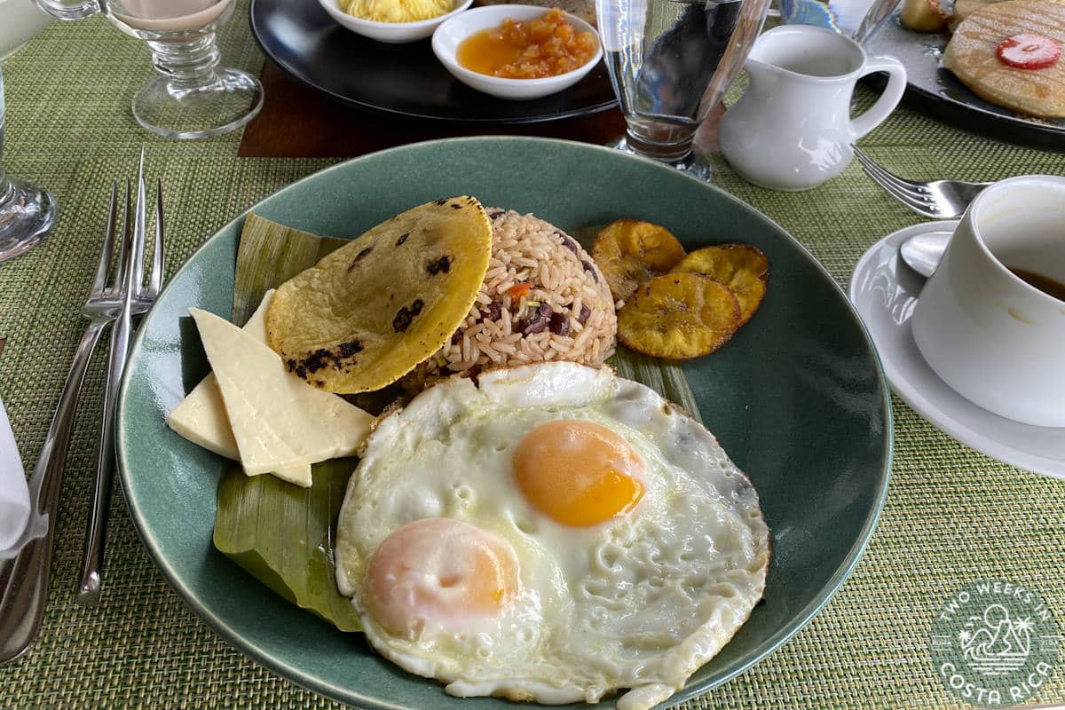 a plate with eggs and rice and beans