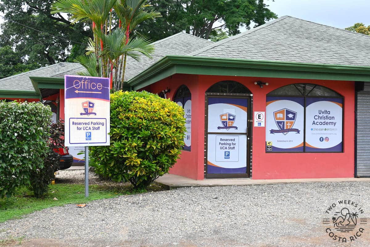 a school building with a sign that says uvita christian academy