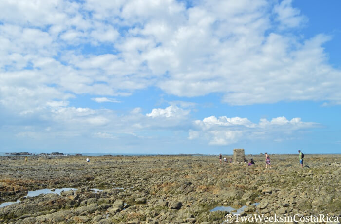 People walking on the rocks at the Whale Tail in Uvita