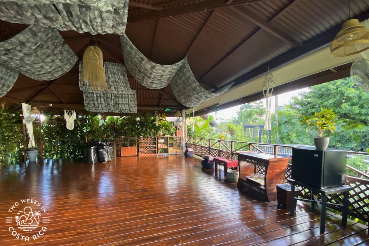 an open air structure with a wooden floor